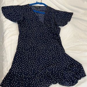 Mini wrap dress in navy with white polka dots. Size L.